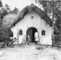 Schilders druk met het huisje van <a href="/lemma/Vrouw_Holle" title="Vrouw Holle">Vrouw Holle</a>
