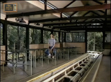 Hans de Booij tijdens een videoclip in het station van de <a href="/lemma/Python" title="Python">Python</a>, zoals te zien in Op Volle Toeren in <a href="/lemma/1983" title="1983">1983</a>