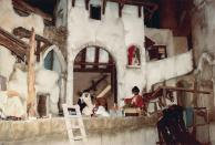 Armenwijk, 05-1985. De armenwijk na het plaatsen van de eerste figuren. De kamelendrijver, wiens kamelen nog missen, zit nog een meter te ver naar rechts. De ezeldrijver heeft een warrige pruik die later wordt vervangen door een hoofddeksel. De open rug en billen van de ezel worden uiteindelijk voorzien van een transportkist en lappen stof.  De tierende man heeft een rood gordijn, dat nog voor de opening wordt vervangen voor een neutraler crème gordijn. Rechts voor de brug staat een kledingrek met diverse alternatieve textielen en een berg lege kledinghoezen.